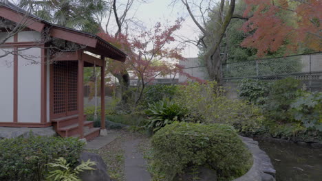 the entrances to temples in japan have very detailed and precise gardening, wooden architecture and landscaping work