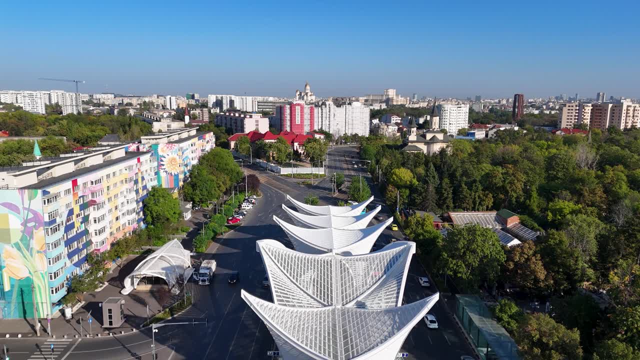 Drone View Over the Heroes' Gate Monument in Eroii Revolutiei Square with the Morning Traffic Below, Bucharest, Romania