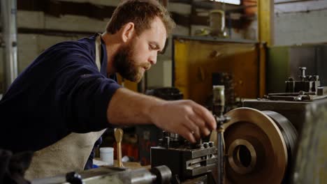 metalsmith working in workshop 4k