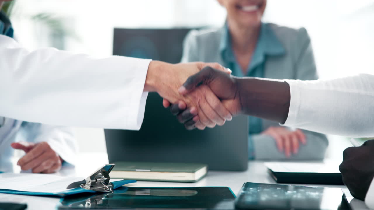 Doctors shaking hands in a medical collaboration