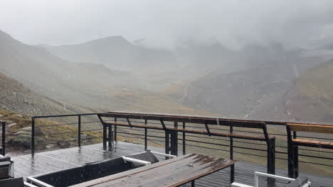 hail pouring down on observatory deck in mountains, stepatsminda, georgia