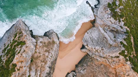 Beach-areal-view,-bird's-eye-view-of-breaking-waves-on-tropical-beach