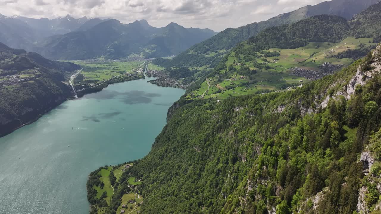 Aerial view of Walensee and the lush green cliffs near Seerenbach Falls in eastern Switzerland.