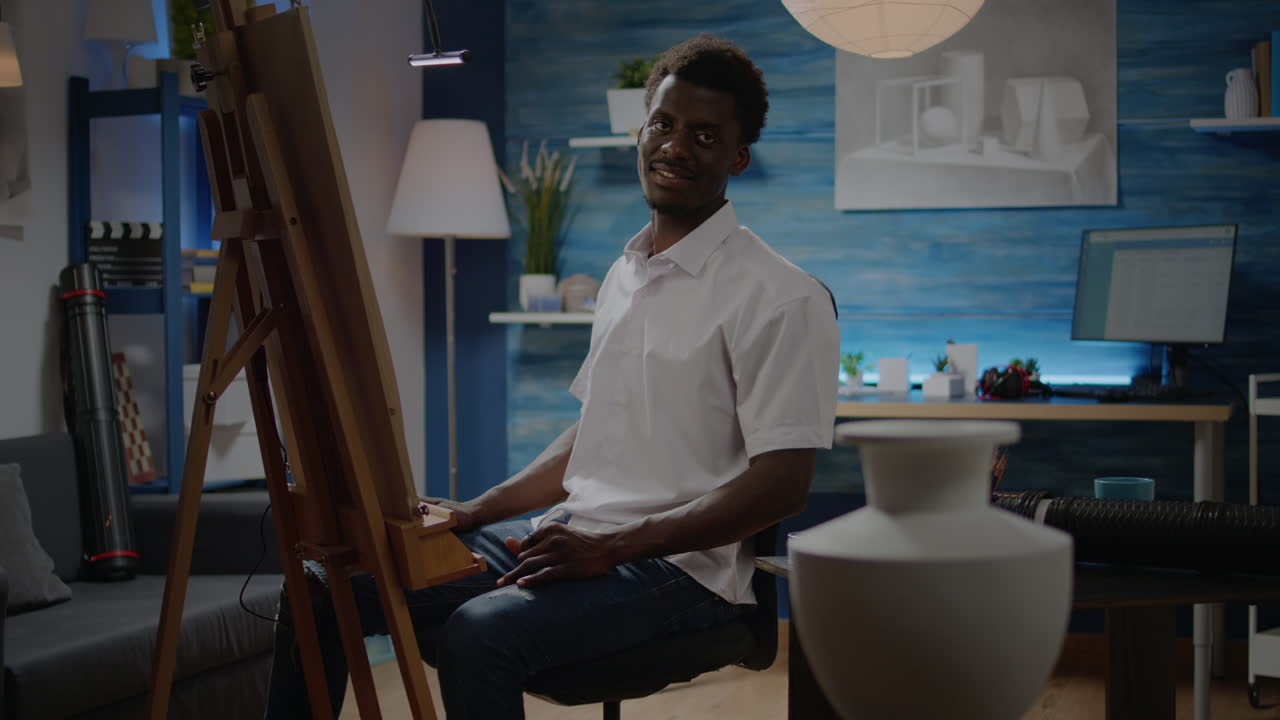 Black man in art studio preparing for creativity process
