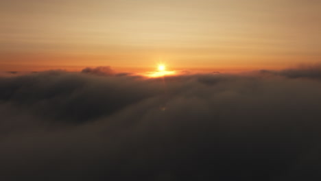 sunrise or sunset through a cloud sea