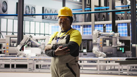 vertical video portrait of smiling technician in industrial plant working to diagnose equipment