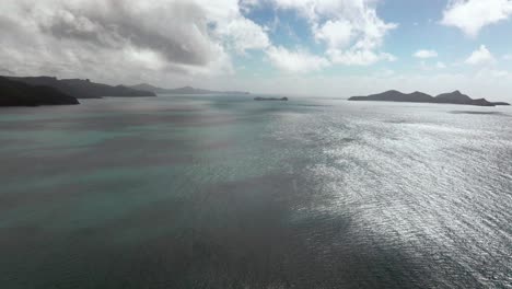 Hook-Island-Tongue-Bay-windy-Whitsundays-Islands-North-end-Hill-Inlet-Lookout-Whitehaven-Beach-aerial-drone-picturesque-sandy-scenic-flight-view-sunny-clouds-moving-summer-forward-motion