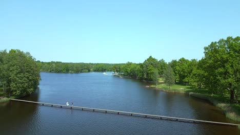 wooden footbridge magic aerial top view flight natural summer paradise idyllic island in lake, chlum in czech, day 2023