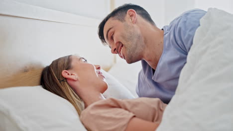 Happy,-relax-and-couple-kissing-in-bed