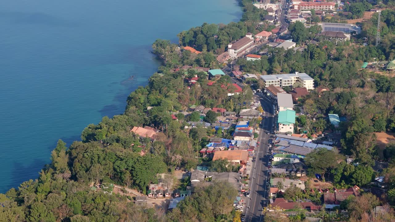 Drone perspective of White Sand Beach village, Koh Chang. Sunny morning aerials of Thailand's coastal beauty on the island of Koh Chang
