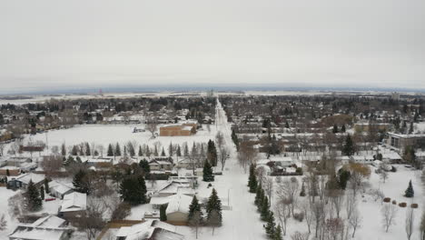 drone view over snow-covered dauphin, manitoba during wintertime