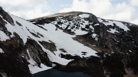 Aerial-view-slowly-pulling-away-from-Saint-Mary's-Glacier-in-Colorado's-Rocky-Mountains