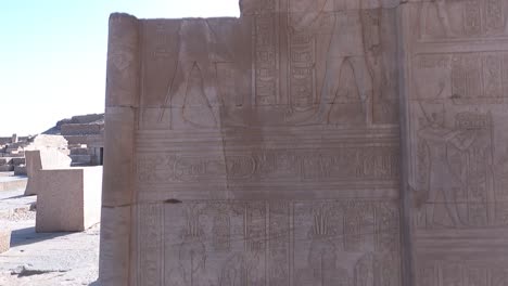 carvings on wall of ancient kom ombo temple in aswan, egypt