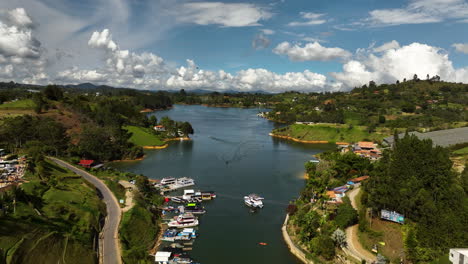 aerial view over boats and a marina in the peñol-guatapé reservoir in colombia