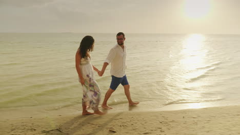 Young-Couple-In-Love-In-Light-Clothes-Carefree-Running-On-A-Clean-Tropical-Beach
