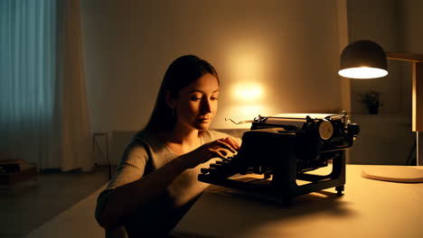 woman typing on a typewriter at night