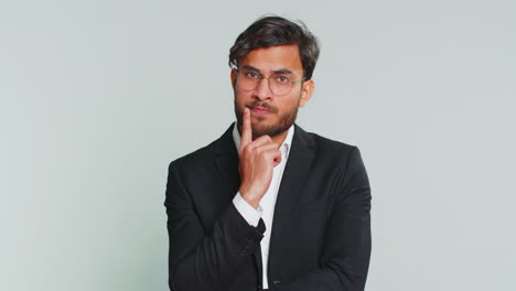 indian business man pondering imagining in mind wondering difficult solution answer question