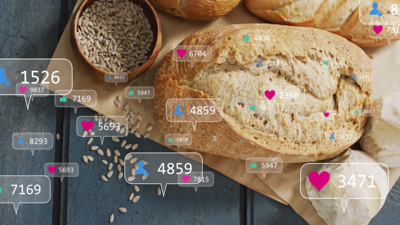 Bread and seeds with animation of social media interaction icons surrounding them