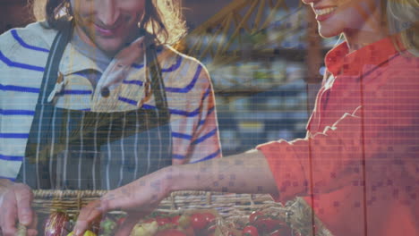 animation of financial graphs over happy caucasian male seller and female customer in grocery shop