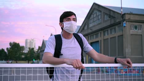 Guy-Wearing-Shirt-With-White-Face-Mask-Looking-At-Beautiful-Seascape-In-Port-Of-Puerto-Ingeniero-White,-Buenos-Aires,-Argentina