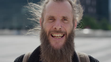 portrait mature bearded hippie man laughing happy enjoying carefree urban lifestyle in city wearing nose ring