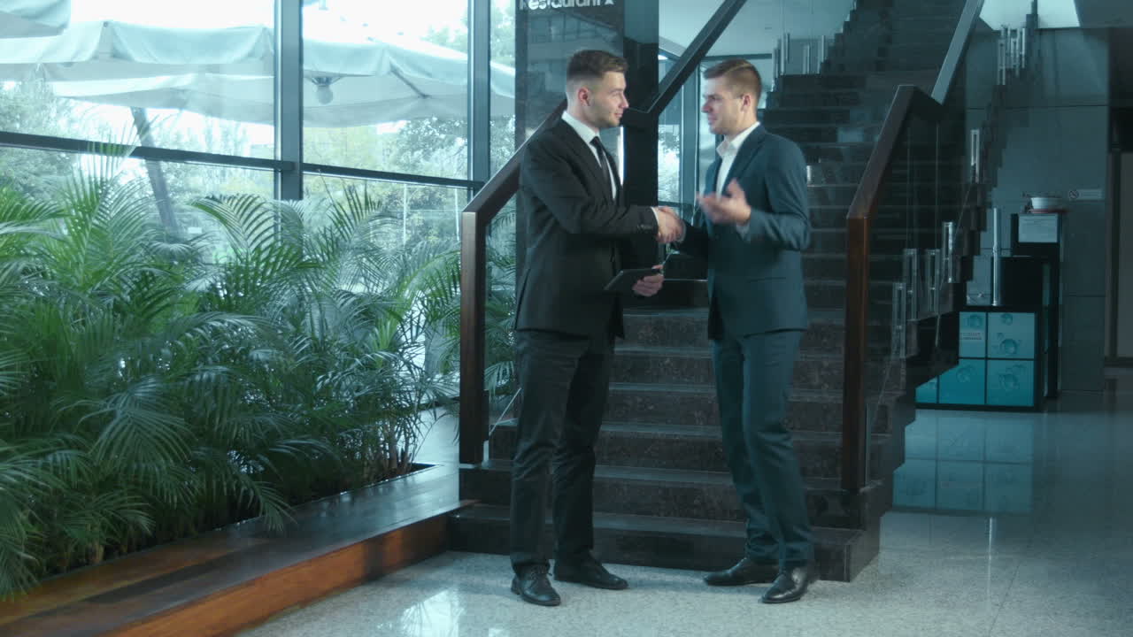 Businessmen in Suits Discussing Deal