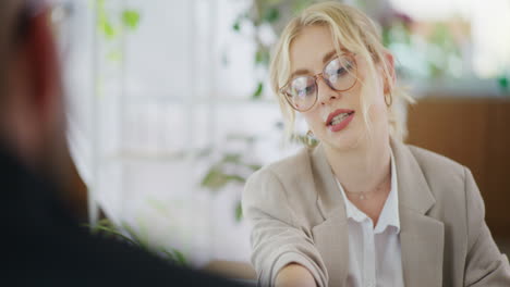 accountant uses calculator and presents costs to client