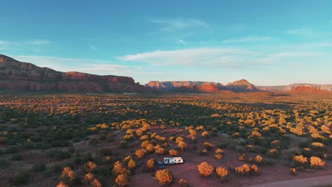 recreational vehicle parked in vegetated desert in sedona red rocks, arizona