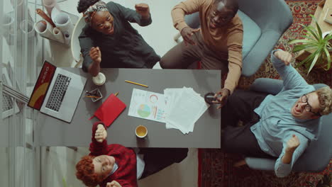 business team celebrating success at office meeting