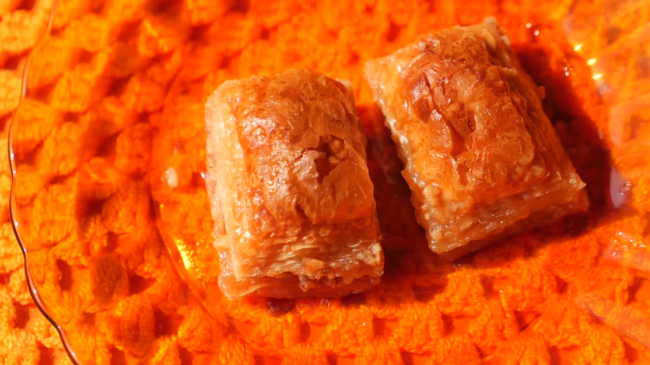 Delicious Baklava on an Orange Plate