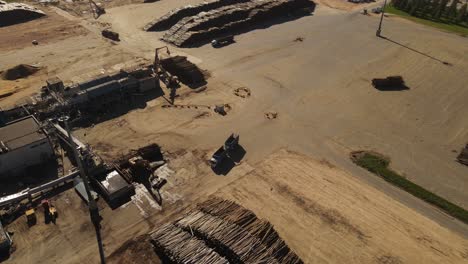 aerial view of empty trunk driving in paper mill factory for transport during sunny day