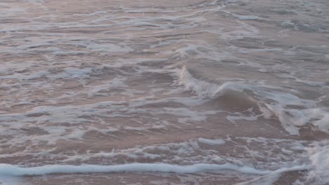 sea waves rushing on sandy shore of socotra, yemen