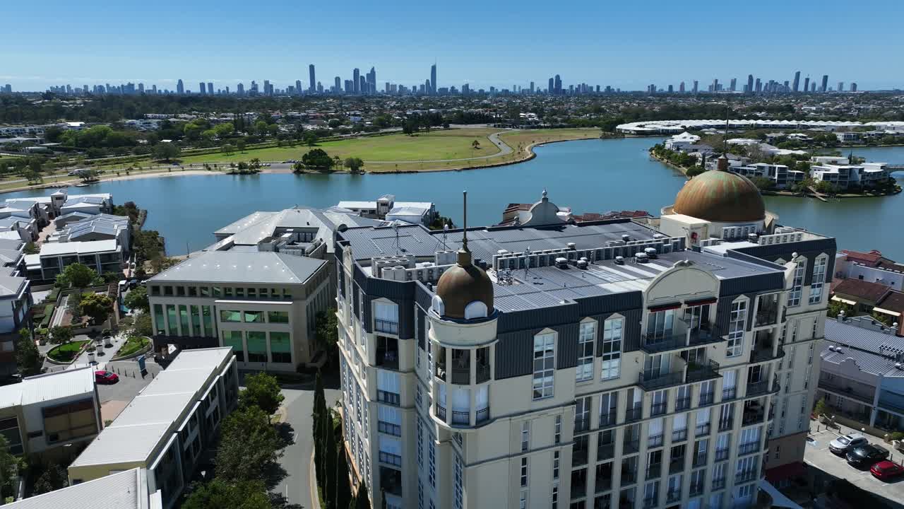 Experience stunning drone footage of Gold Coast's Emerald Lakes and Surfers Paradise skyline, capturing the vibrant cityscape and serene lakes from an aerial perspective.