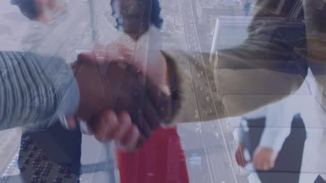 Animation-of-diverse-business-people-shaking-hands-over-cityscape
