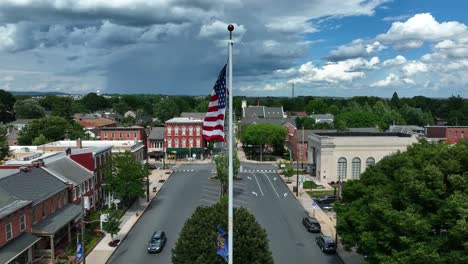 flags of pa pennsylvania and usa in town square