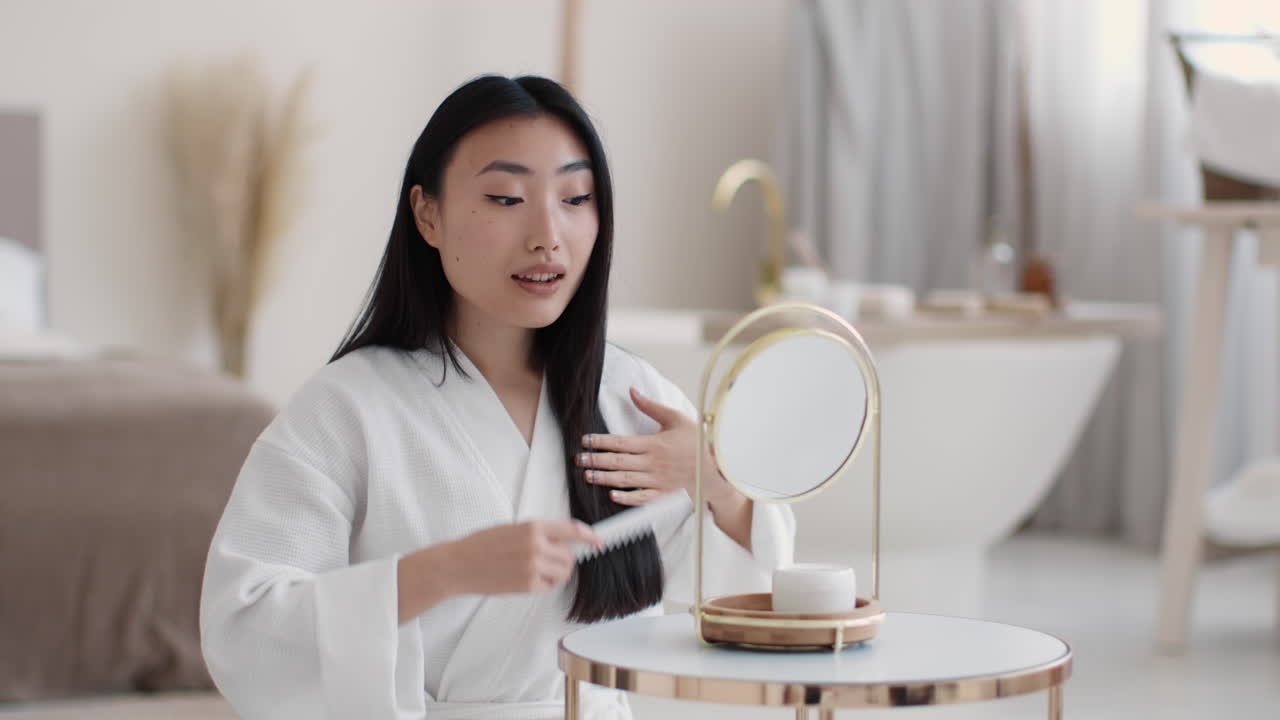Woman Combing Hair in the Morning