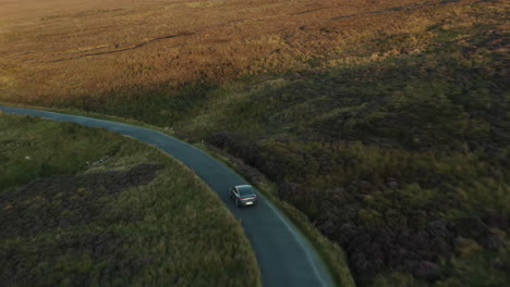 aerial view, car driving through mountain roads. 4k