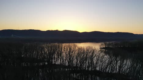 sunrise over a river and mountains