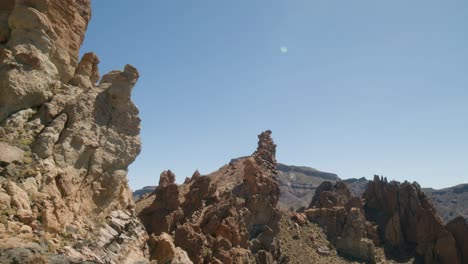 Volcanic-rock-formations-in-barren-ladscape-in-Los-Roques-de-Garcia,-Teide-National-Park-in-Tenerife,-Canary-Islands-in-spring