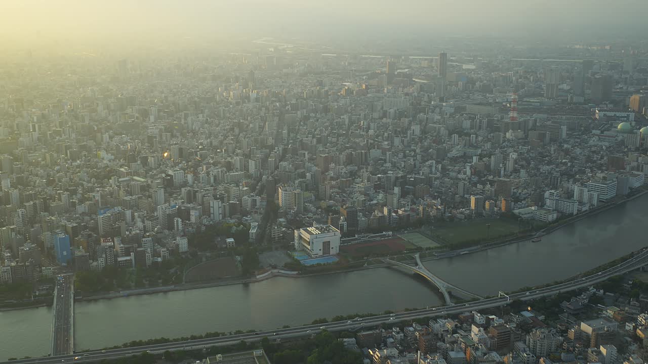 Aerial View Of A Densely Populated Urban Area With A Running River In Tokyo, Japan