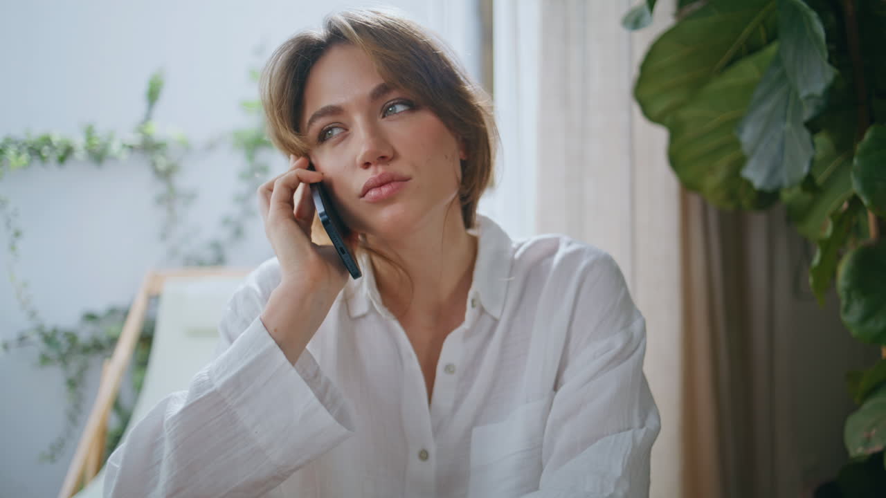 Lady finish phone call eating at modern home apartment closeup. Relaxed woman