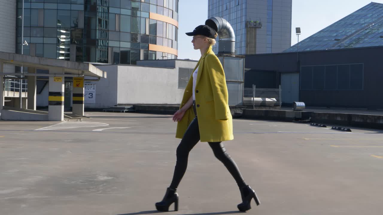 Confident model look woman with high heels practice walking runway on the roof of the parking lot
