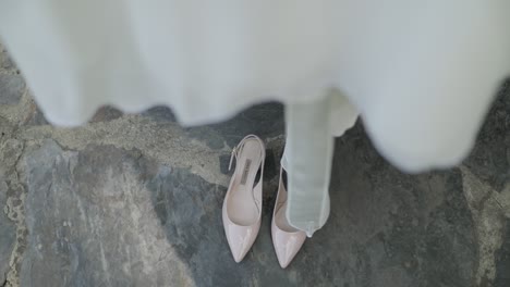 wedding shoes showing up under the dress