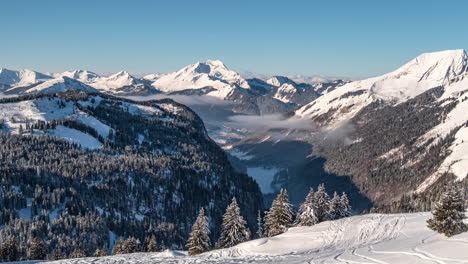 wide timelapse of skiers skiing run at chatel valley, avoriaz ski resort