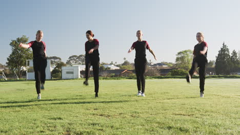 playing cricket, women practicing on field under clear sky, enjoying game