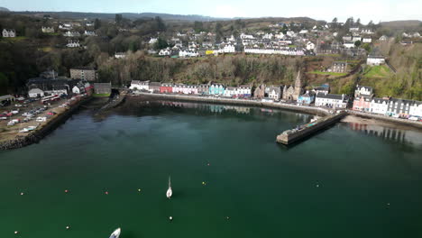 dolly arc aerial of beautiful bay in small town of tobermory