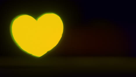 yellow energy heart shapes on a dark background