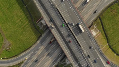aerial. traffic interchange. top view of the road, city and forest. summer video from the drone.