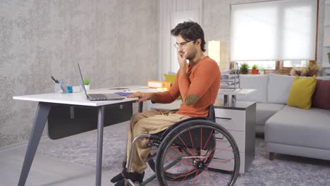 sad and stressed student. disabled student working with laptop.