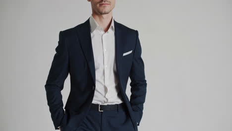 close-up of a man in a dark suit and white shirt